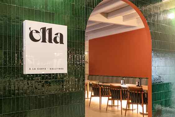 Ella restaurant, sign at entrance on green wall