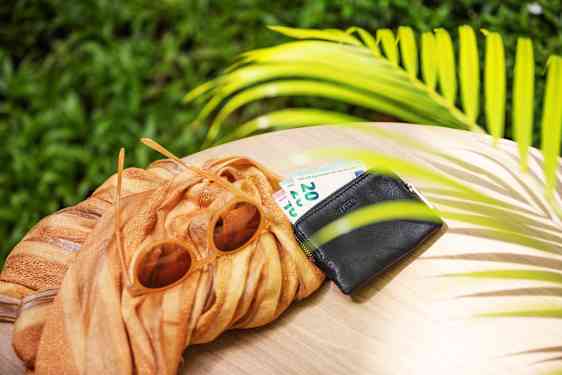 Money in wallet on table