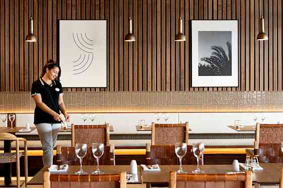 Men and women laughing at table