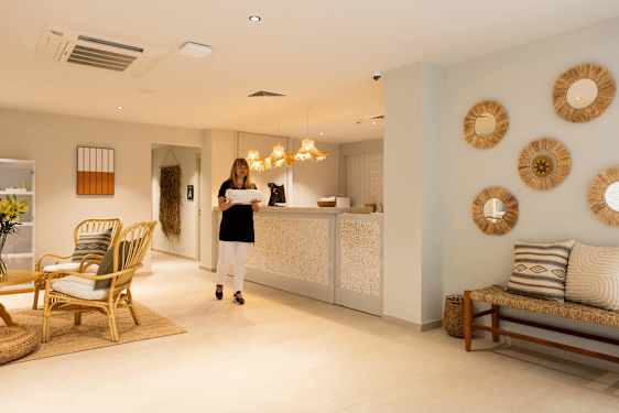 Staff carrying towels in spa