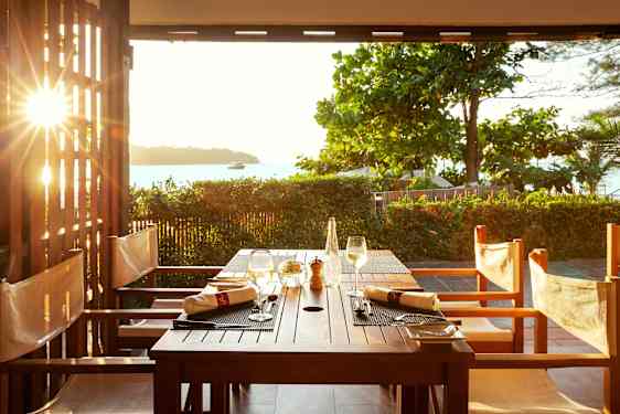 Restaurant by the beach in sunset