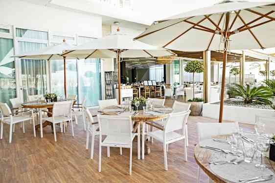 Staff setting tables in restaurant