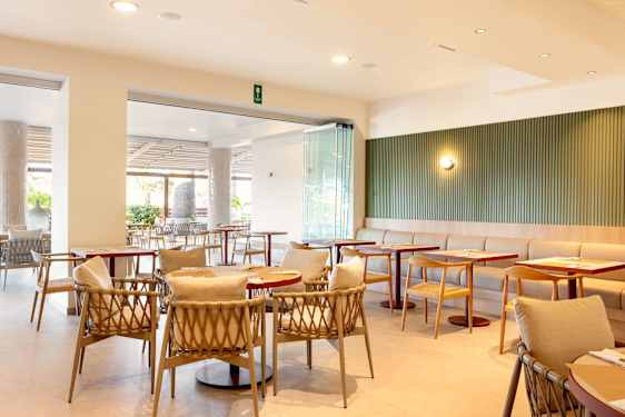 Waiter carrying drink in restaurant