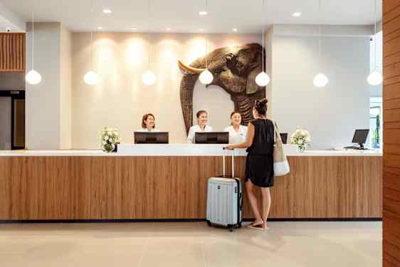 Woman with bag in reception