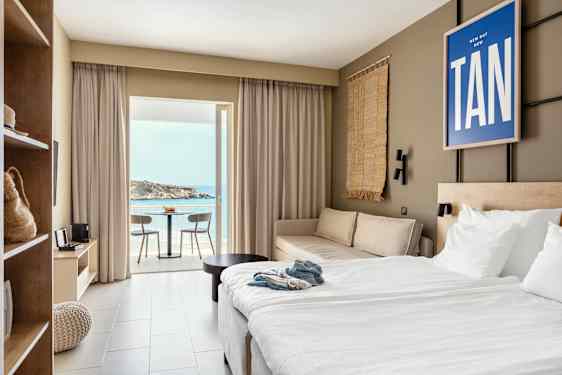 Hotelroom in beige colours and blue poster