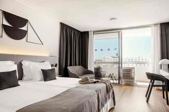 Bed and chair in grey nuanses