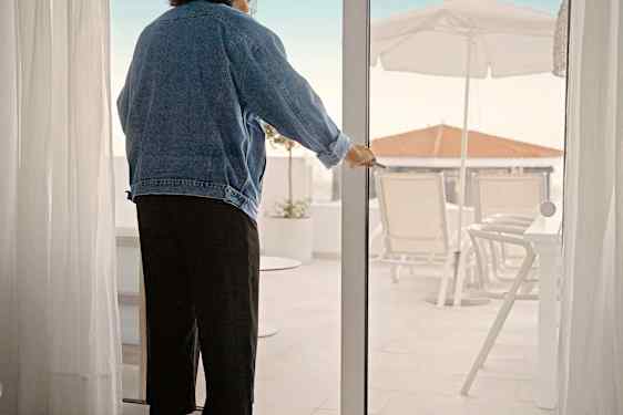 Woman standing by a door