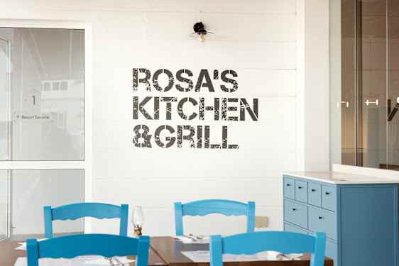 Rosa's Kitchen sign on wall