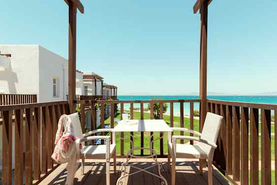 Bed and chair in beige nuanses