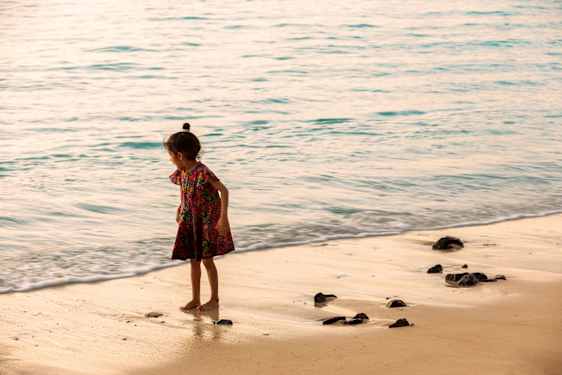 girl on the beach by the shorline