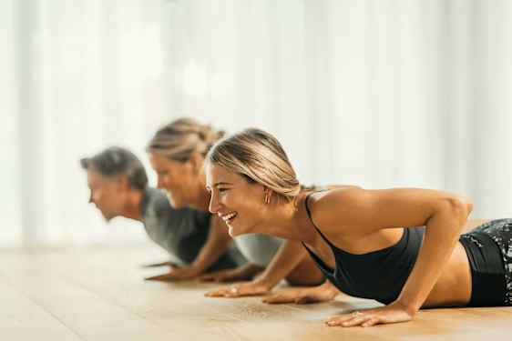 Three persons on gym floor
