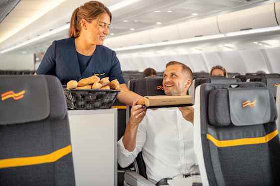 Air steweradess serving a man