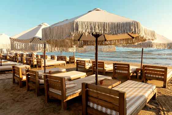 Beach with sunbeds by the sea