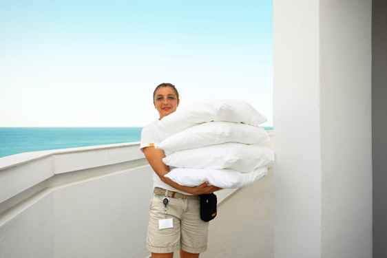 Staff carrying pillows