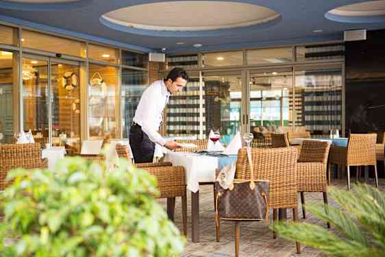 Waiter setting table