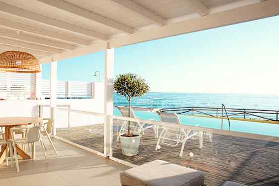 View over sea from hotelroom with pool