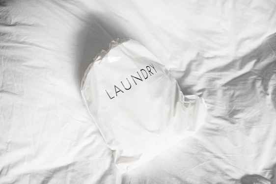 Laundry bag on white sheets