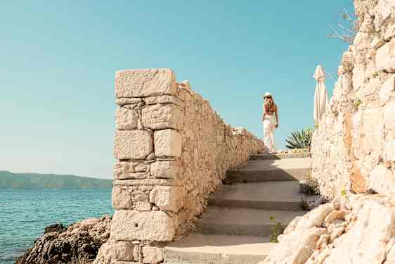 Ocean Beach Club Crete, woman walking at poolarea