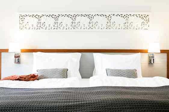 Light hotelroom with wooden details