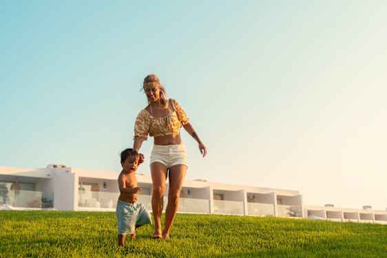 Woman with child on grass